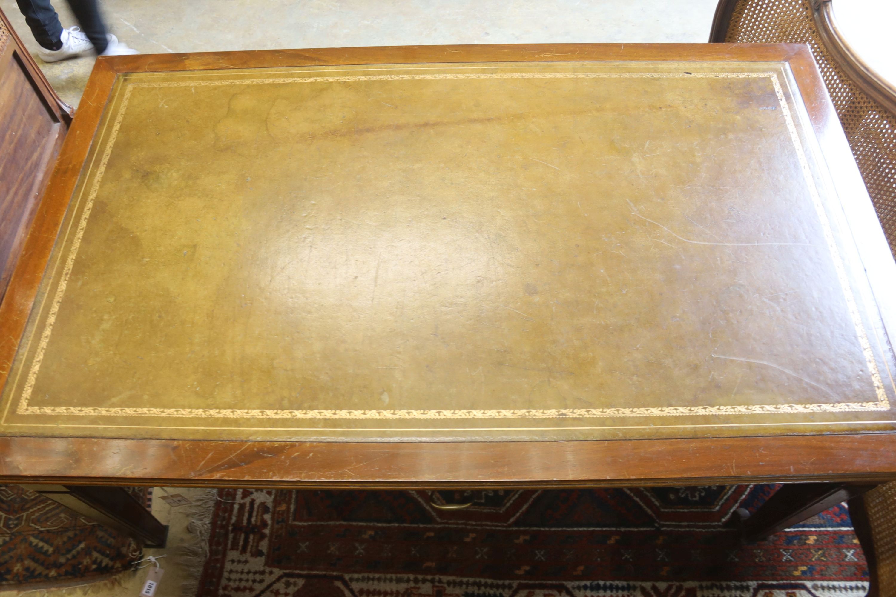 A mahogany two drawer writing table, with a green leather inset top, width 150cm, depth 90cm, height 75cm